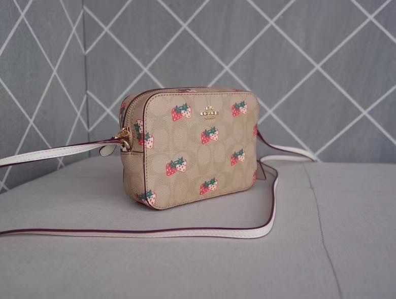 Coach MINI CAMERA BAG IN SIGNATURE CANVAS WITH STRAWBERRY PRINT IM/KHAKI MULTI Signature coated canvas with smooth leather details| Two credit card slots| Inside multifunction pocket| Zip closure, fabric lining| Outside open pocket| Adjustable strap with