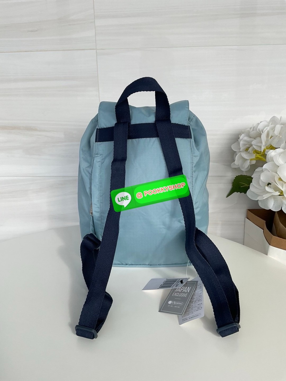 🚚 พร้อมส่ง 🚚 Japan LeSportsac Casual Versatile Portable Women's Bag Solid Color Blue Bucket Bag Flip Backpack สินค้าแบรนด์แท้100% พร้อมแท็ก! กระเป๋าเป้สะพายหลังลําลอง ทรงบักเก็ต น้ําหนักเบา กระเป๋าเป้หูรูด กระเป๋าเดินทางขนาดกลาง ด้านห