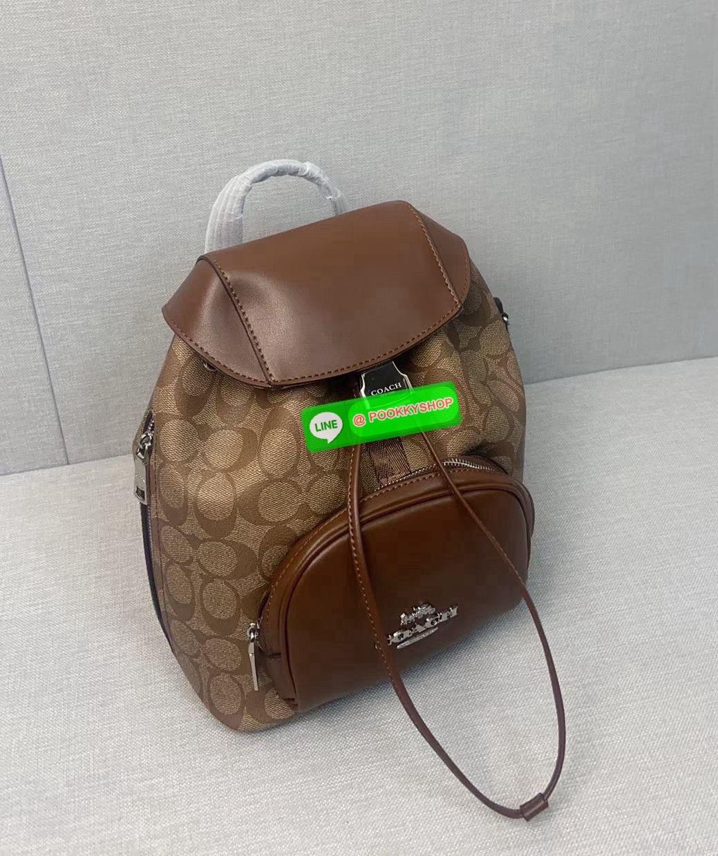 COACH PACE BACKPACK COACH CR100 | Refined calf leather | Inside zip and multifunction pockets | Drawstring and speedclip closures, fabric lining | Handle with 3" drop | Outside zip pocket | Outside zip access to interior |