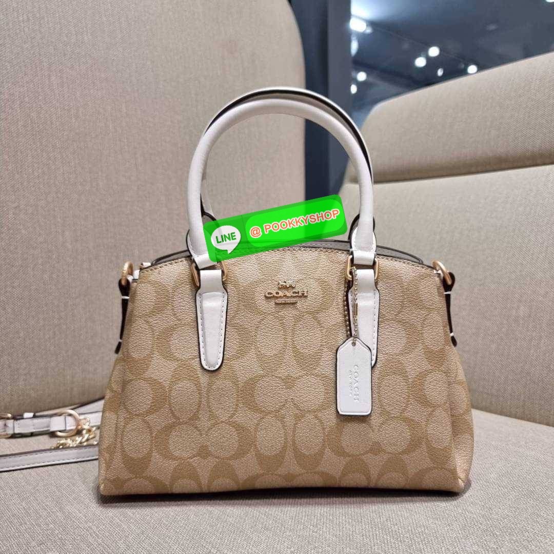 COACH F29434 MINI SAGE CARRYALL IN SIGNATURE CANVAS รุ่นยอดฮิต!! ที่สุดของกระเป๋าสะพายขายดี ต้องทรงถังมินิรุ่นนี้ วัสดุหนังแคนวาสเคลือบลาย สวย คลาสสิค มาพร้อมสายสะพายข้างและหูหิ้วในตัว ถอดออกถือคล้องแขนเก๋ๆ หรูๆยังได้ ภายในเป็นช่องโล่ง แบ่งสัดส่วนอย่างดี
