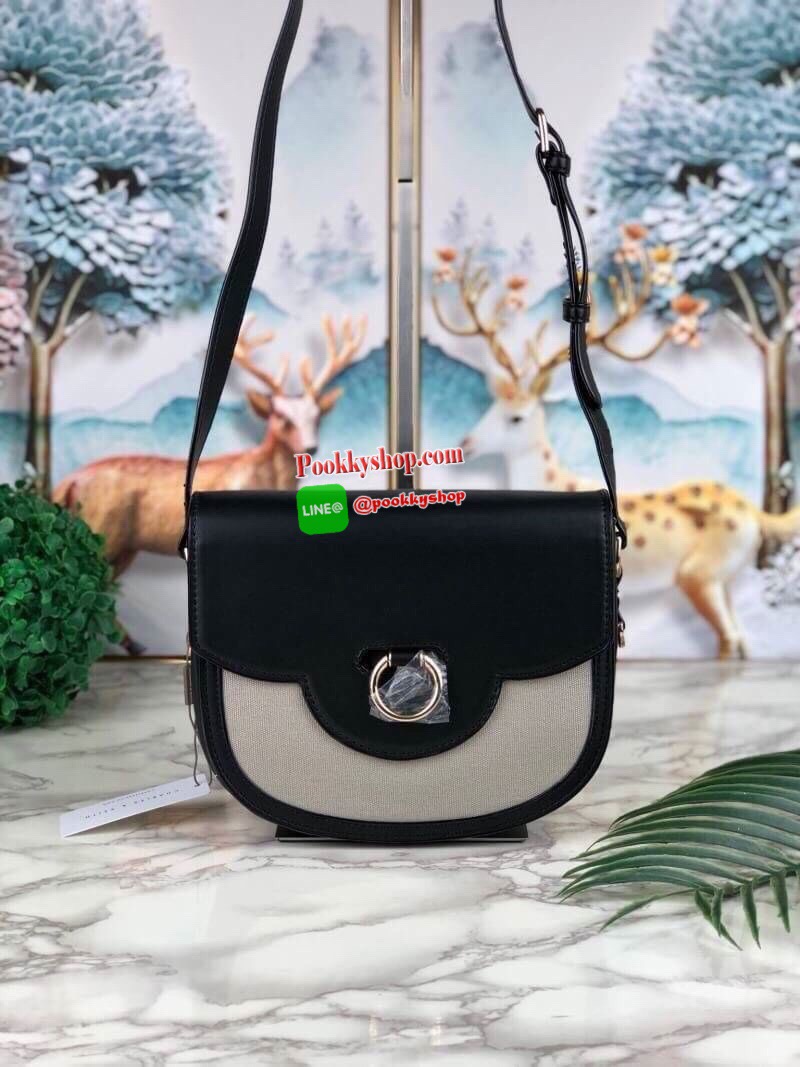 New arrival! 2019 CHARLES & KEITH RING BUCKLE SADDLE CROSSBODY BAG รุ่ยใหม่ชนช็อป!!! กระเป๋าสะพายข้าง/ครอสบอดี้อยู่ทรง วัสดุหนังตัดผ้าด้สนหน้า ด้านหลังมีช่องใส่ของได้เล็กน้อย เปิดปิดด้วยตัวล็อกดันขึ้น ด้านในเป็น 2 ช่องใหญ่ ใส่ของได้พอสมควรค่ะ เช่น iPhone