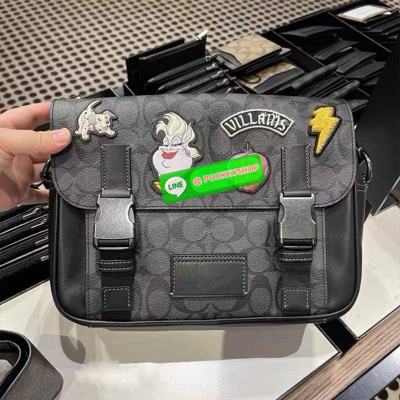 Coach Disney X Coach Track Crossbody In Signature Canvas With Patches Signature coated canvas and smooth calf leather Inside multifunction pockets Zip and speedclip closures, fabric lining Outside slip pocket