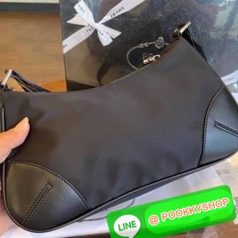 prada nylon shoulder bag black This chic shoulder bag is crafted of fine tessuto nylon in black. This bag features sturdy calfskin leather top handle and silver hardware. The top zipper opens with a black jacquared fabric interior with zipper pocket. This