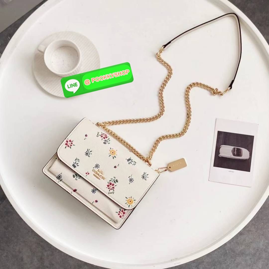 KLARE CROSSBODY WITH Flowers EMBROIDERY IM/CHALK MULTI Smooth leather| Inside zip and multifunction pockets| Snap closure, fabric lining| Outside slip pocket| Strap with 22" drop doubles up for three ways to wear: short or long on the shoulder or cro