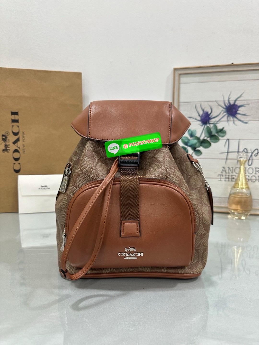 COACH PACE BACKPACK COACH CR100 | Refined calf leather | Inside zip and multifunction pockets | Drawstring and speedclip closures, fabric lining | Handle with 3" drop | Outside zip pocket | Outside zip access to interior |