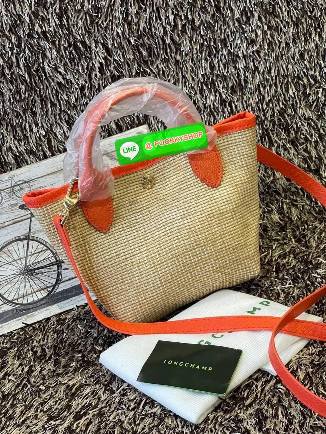 ðLONGCHAMP Le Pliage Paris - St Tropez Handtasche āļĢāļļāđāļāđāļŦāļĄāđāļāļēāļāđāļāļĢāļāļāđ āđāļāđāļāļāļĢāļ°āđāļāđāļēāļāļ·āļāļŦāļĢāļ·āļāļŠāļ°āļāļēāļĒ āļāļēāļāļŠāļēāļ raffia āļāļēāļāļāļĢāļ°āđāļāđāļēāļāļąāļāļāđāļ§āļĒāļŦāļāļąāļāļŠāļĩāļāđāļ§āļĒāļĨāļļāļāļāđāļŠāļļāļāđāļāđāļāļāļāđāļŦāļĨāđāļē Celebrities āļāļąāļāļāļĢāļ°āđāļāđāļēāļāļīāļāļāļīāļāļŠāļļāļāļŪāļīāļāļāļēāļ Longchamp āļāļĒāđāļēāļ Le Pliage Paille (āđāļĨāļ āļāļĨāļīāļĒāļēāļ āđāļāļĨāđ) āļĄāļĩāđāļĨāđ