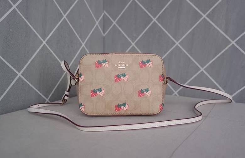 Coach MINI CAMERA BAG IN SIGNATURE CANVAS WITH STRAWBERRY PRINT IM/KHAKI MULTI Signature coated canvas with smooth leather details| Two credit card slots| Inside multifunction pocket| Zip closure, fabric lining| Outside open pocket| Adjustable strap with