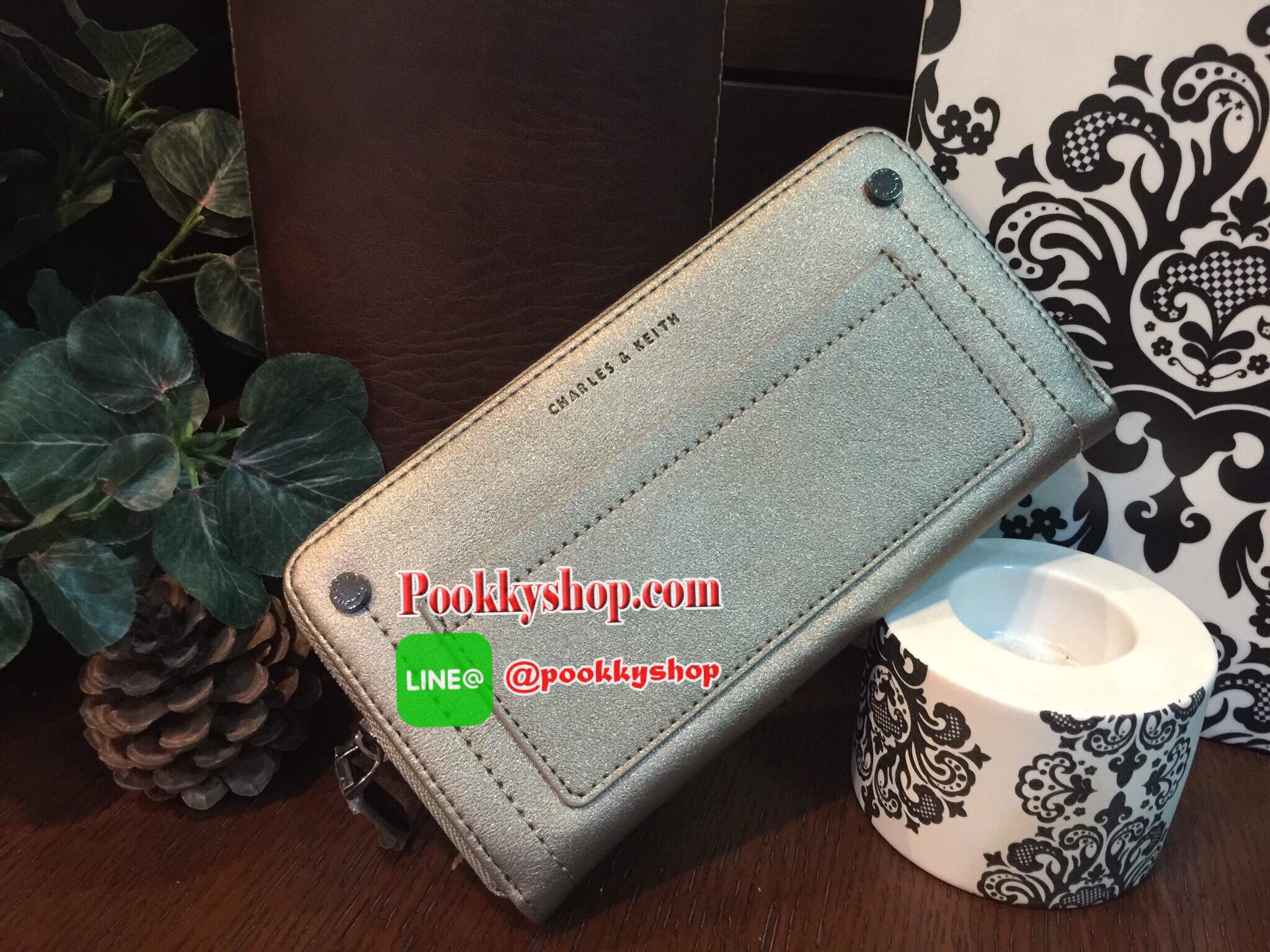 NEW! CHARLES & KEITH STUDDED FRONT POCKET WALLET กระเป๋าสตางค์ใบยาวซิปรอบรุ่นใหม่ล่าสุดแบบชนช็อปวัสดุหนังเรียบอยู่ทรงสวย เปิดปิดด้วยซิปรอบด้านหน้าแต่งหมุด พร้อมปั้มโลโก้ด้านหน้าดูสวยหรูมีสไตล์ ภายในมีช่องซิปและช่องใส่บัตรหลายช่องใส่ iphone7+ ธนบัตร บัตรได