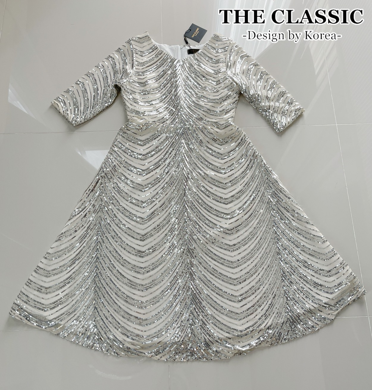 เดรสแฟชั่น ชุดเดรสออกงานปักเลื่อมใช้ผ้าเนื้อดีปักด้วยเลื่อมสีเงิน