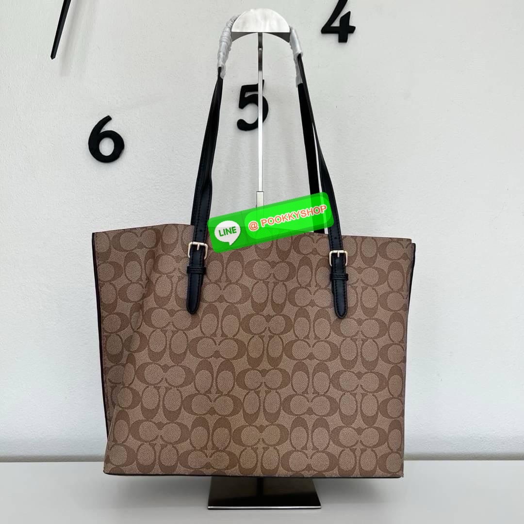 Coach MOLLIE TOTE IN SIGNATURE CANVAS (COACH 1665) กระเป๋าหนังใบเคลือบซิกเนเจอร์และหนังเรียบ ภายในกระเป๋ามัลติฟังก์ชั่น ปิดด้วยซิป ซับในผ้า หูหิ้วพร้อมหูหิ้ว 10 1/4" ช่องเปิดด้านข้าง