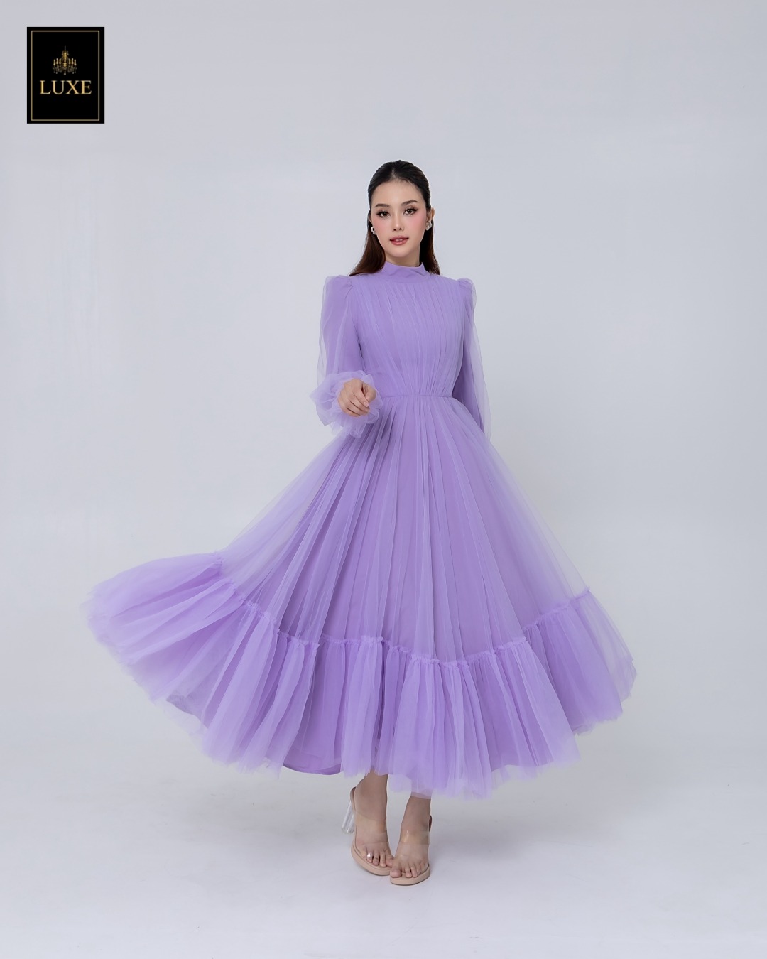 เดรสแฟชั่น แม็กซี่เดรสเสื้อคอปีนแขนยาว กระโปรงบานต่อชายรูดระบายรอบตัว มีโบว์ผูกเอว