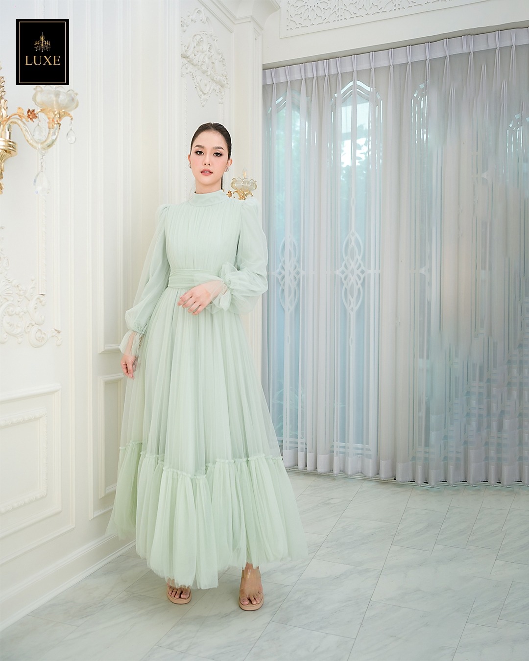 เดรสแฟชั่น แม็กซี่เดรสเสื้อคอปีนแขนยาว กระโปรงบานต่อชายรูดระบายรอบตัว มีโบว์ผูกเอว