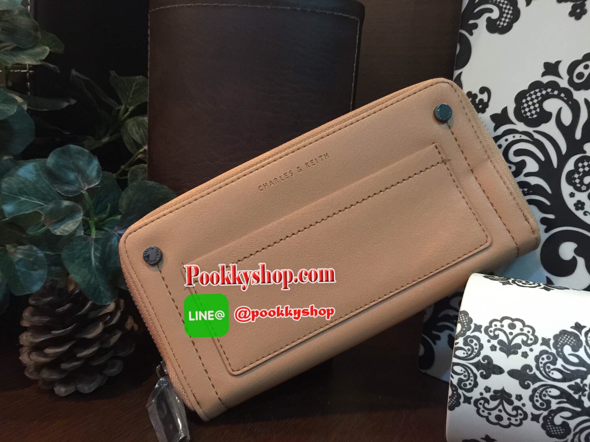NEW! CHARLES & KEITH STUDDED FRONT POCKET WALLET กระเป๋าสตางค์ใบยาวซิปรอบรุ่นใหม่ล่าสุดแบบชนช็อปวัสดุหนังเรียบอยู่ทรงสวย เปิดปิดด้วยซิปรอบด้านหน้าแต่งหมุด พร้อมปั้มโลโก้ด้านหน้าดูสวยหรูมีสไตล์ ภายในมีช่องซิปและช่องใส่บัตรหลายช่องใส่ iphone7+ ธนบัตร บัตรได