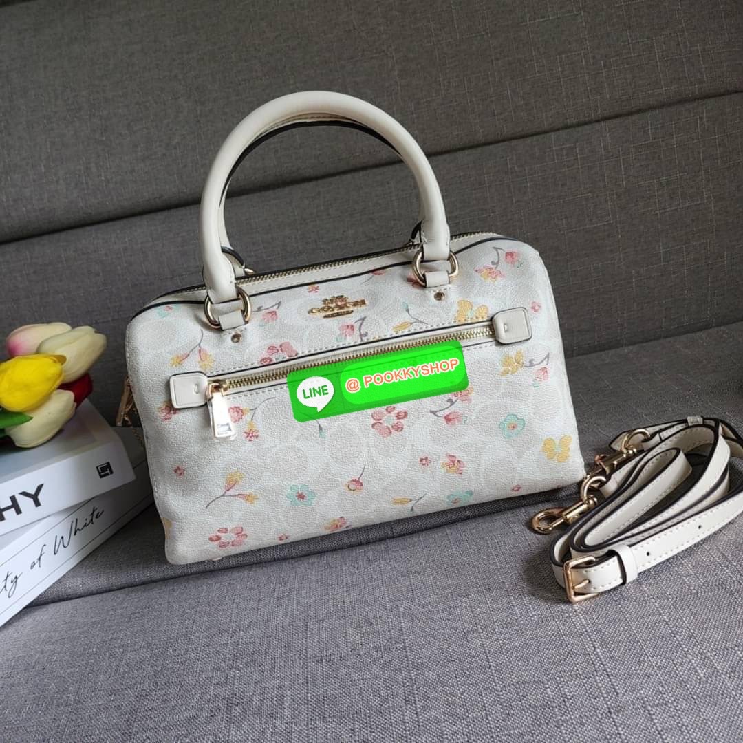 COACH ROWAN SATCHEL IN SIGNATURE CANVAS WITH MYSTICAL FLORAL PRINT (COACH C8615) กระเป๋าสะพายข้างทรงหมอนเป็นอีกรุ่นมาแรงสุดๆ ฮอตตลอด เป็นทรงที่ต้องมาติดตู้ โดดเด่นอย่างลงตัวกับรุ่นนี้ หมอน 10" รุ่นมีช่องซิปด้านหน้า สามารถแยกเก็บของสำคัญๆได้อย่างเป็นส