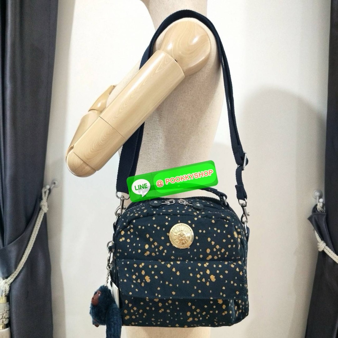 KIPLING Cand 2 ways backpack กระเป๋าถือหรือสะพายข้าง ขนาดกลาง วัสดุ Polyester 100% -ด้านหน้ามี 2 ช่องซิป -ช่องหลักโล่งกว้าง ใส่ของได้เยอะสุดๆ พร้อมช่องซิปและช่องแยกด้านข้างให้แยกของได้เป็นระเบียบมากขึ้น สามารถติใส่กระเป๋าสตางค์ใบยาวได้ มาพร้อมสายคล้องพวงก