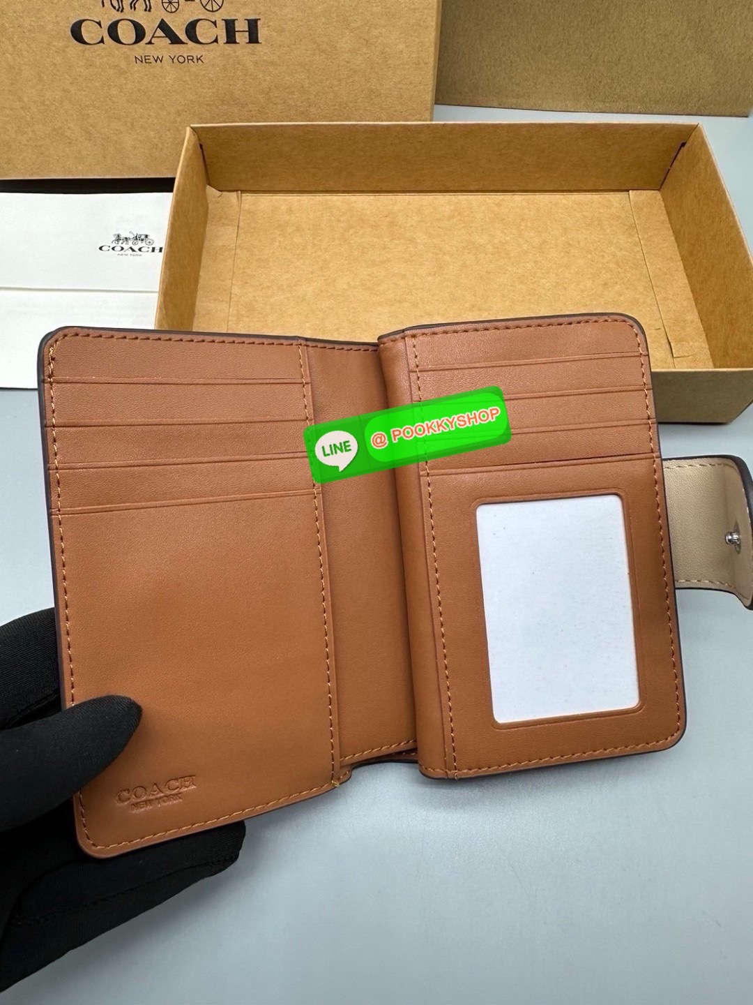 Coach Billfold Wallet With Floral Print Polished pebble leather Eight credit card slots Full-length bill compartment Snap closure Outside zip coin pocket