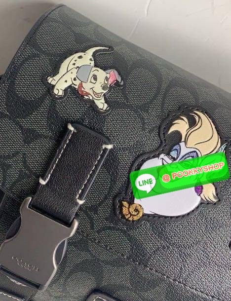 Coach Disney X Coach Track Crossbody In Signature Canvas With Patches Signature coated canvas and smooth calf leather Inside multifunction pockets Zip and speedclip closures, fabric lining Outside slip pocket