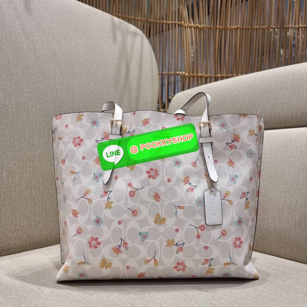 COACH C8612 MOLLIE TOTE IN SIGNATURE CANVAS WITH MYSTICAL FLORAL PRINT กระเป๋าทรงโท้ท ใบใหญ่จุใจ สวยคุ้มค่าดีไซน์ใหม่ น่าใช้ที่สุด วัสดุหนังแคนวาส หูสะพายในตัว ปรับได้อีกเล็กน้อย ภายในโล่งกว้างมาก มีช่องซิปแยกให้ ใบนี้สามารถใส่เสิ้อผ้าไปเที่ยวแบบ short va