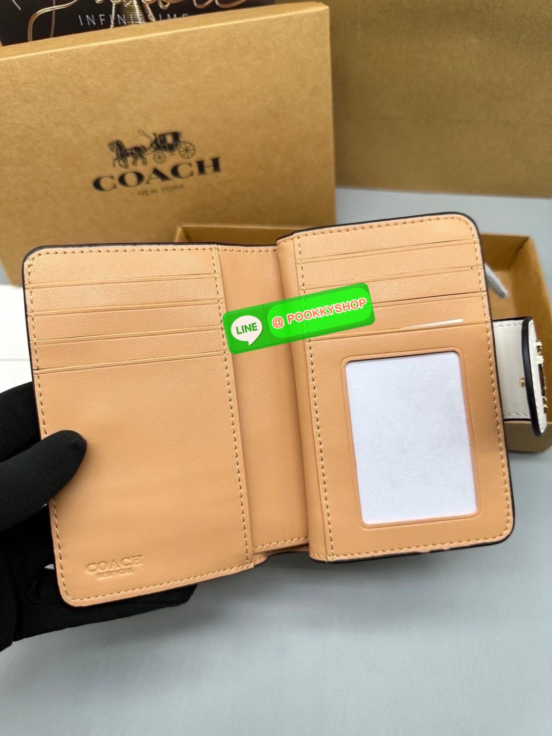 Coach Billfold Wallet With Floral Print Polished pebble leather Eight credit card slots Full-length bill compartment Snap closure Outside zip coin pocket