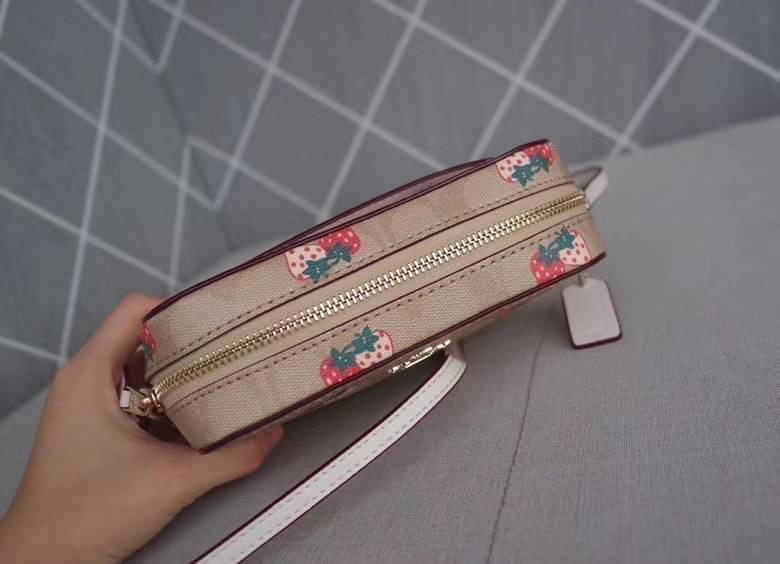 Coach MINI CAMERA BAG IN SIGNATURE CANVAS WITH STRAWBERRY PRINT IM/KHAKI MULTI Signature coated canvas with smooth leather details| Two credit card slots| Inside multifunction pocket| Zip closure, fabric lining| Outside open pocket| Adjustable strap with