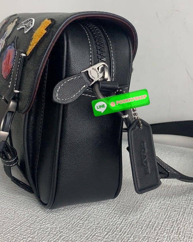 Coach Disney X Coach Track Crossbody In Signature Canvas With Patches Signature coated canvas and smooth calf leather Inside multifunction pockets Zip and speedclip closures, fabric lining Outside slip pocket