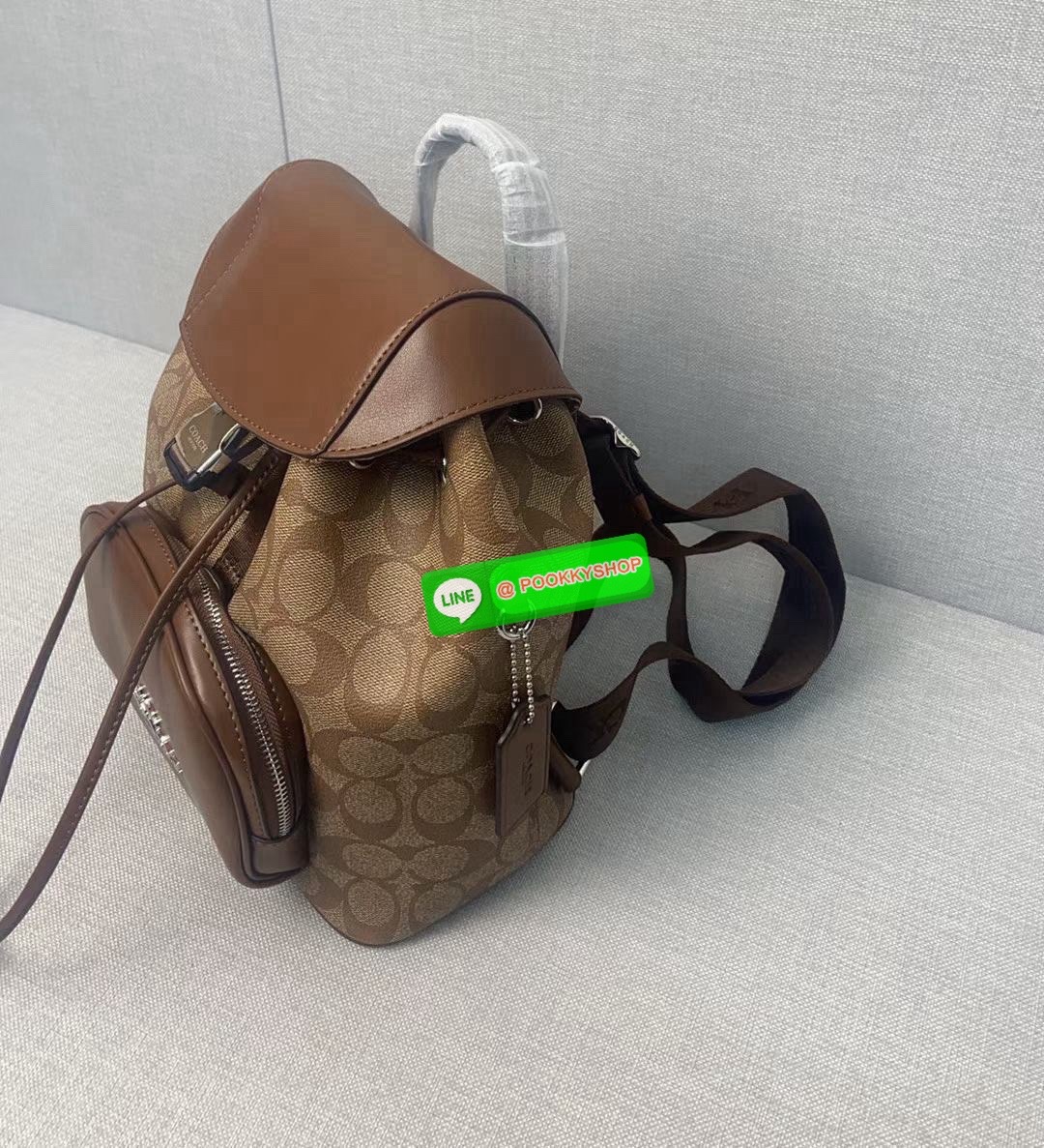 COACH PACE BACKPACK COACH CR100 | Refined calf leather | Inside zip and multifunction pockets | Drawstring and speedclip closures, fabric lining | Handle with 3" drop | Outside zip pocket | Outside zip access to interior |