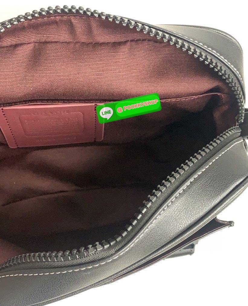 Coach Disney X Coach Track Crossbody In Signature Canvas With Patches Signature coated canvas and smooth calf leather Inside multifunction pockets Zip and speedclip closures, fabric lining Outside slip pocket