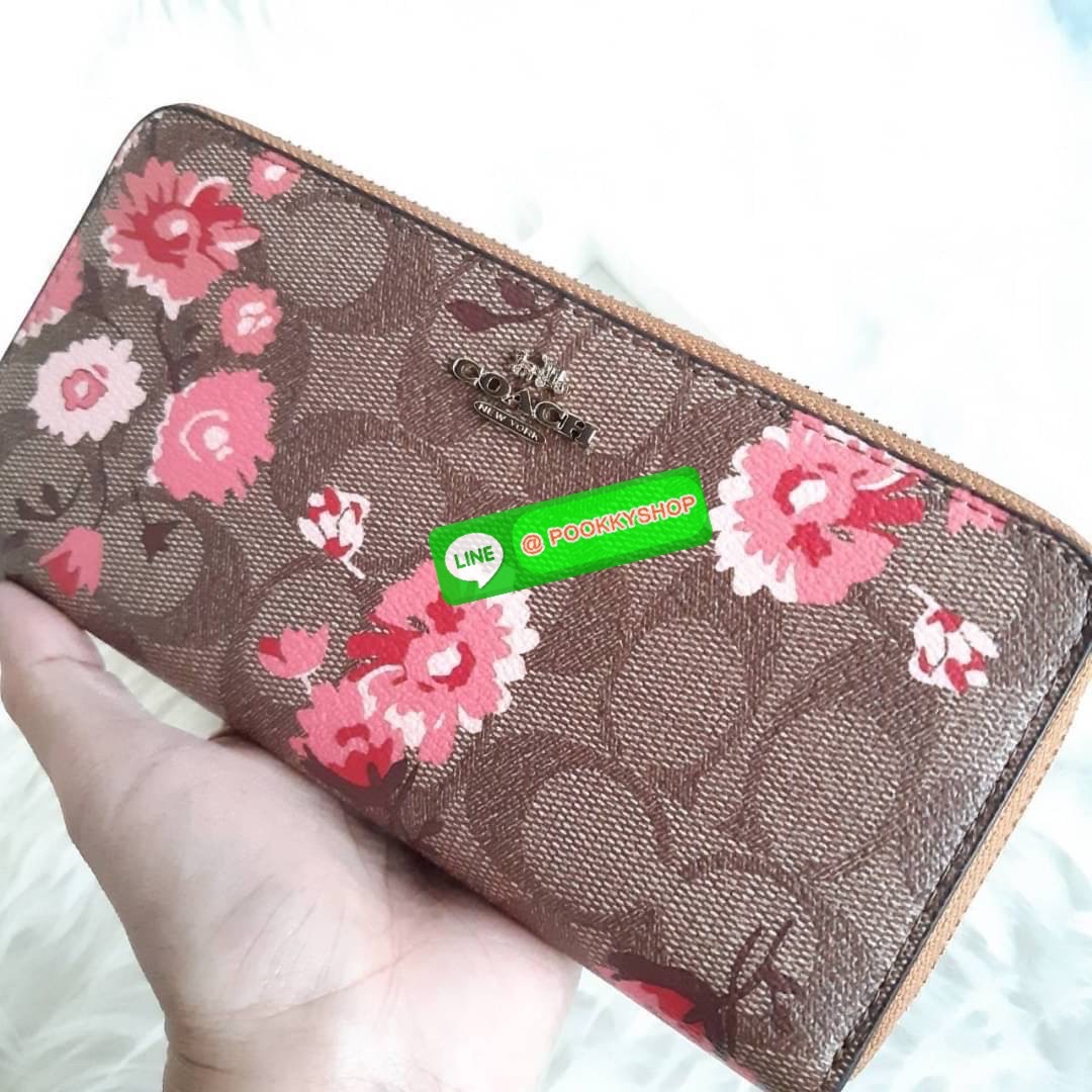 COACH F78018 ACCORDION ZIP WALLET IN SIGNATURE CANVAS WITH PRAIRIE DAISY CLUSTER PRINT ฮอตไม่เลิก!! กระเป๋าสตางค์ใบยาว ลวดลายดอกไม้ ขายดีที่สุด!! วัสดุหนังแคนวาสเคลือบลาย เปิด-ปิดด้วยซิปรอบ รูดใช้งานง่าย ใส่มือถือได้ ใส่บัตร ใส่ธนบัตรได้สบายๆ สวยเกินราคาแ