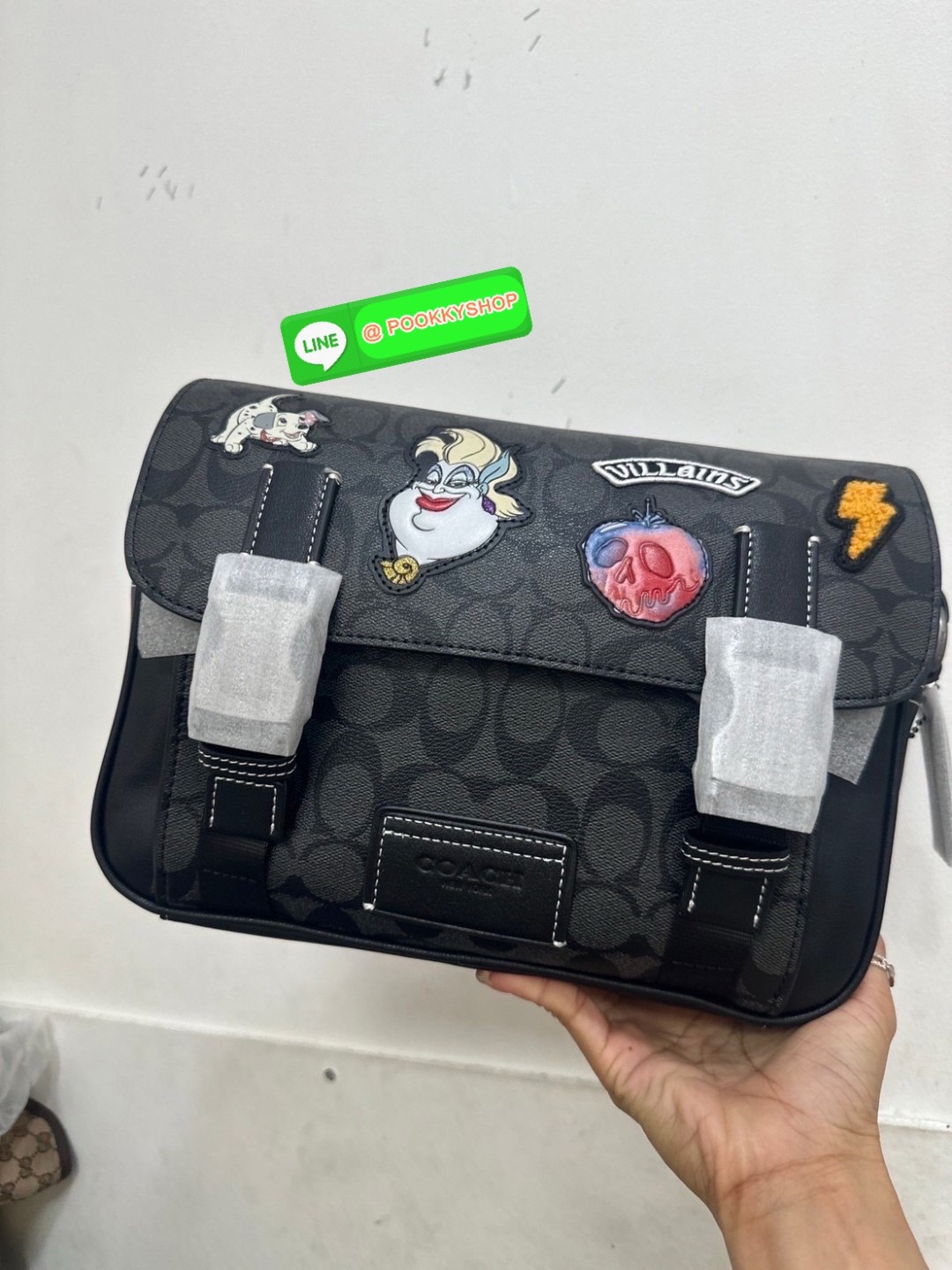 Coach Disney X Coach Track Crossbody In Signature Canvas With Patches Signature coated canvas and smooth calf leather Inside multifunction pockets Zip and speedclip closures, fabric lining Outside slip pocket