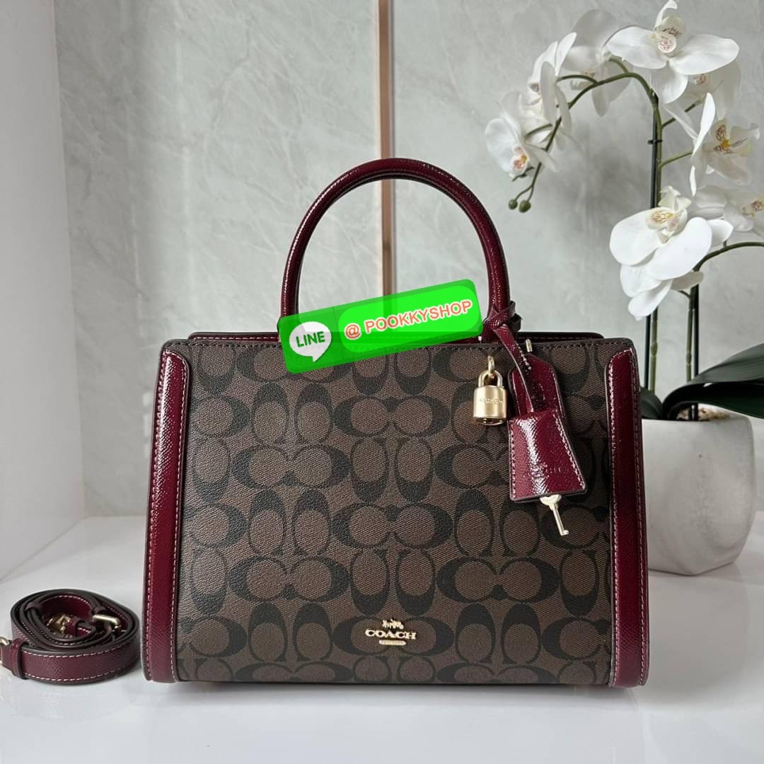 COACH ZOE CARRYALL IN SIGNATURE CANVAS (F87665) 🔖กระเป๋าถือหรือสะพาย ผู้ดีคุณนาย 🔖วัสดุหนังแคนวาส ตัดขอบหนังแท้ 🔖🔖เปิด-ปิดด้วยซิปคู่ ตกแต่งด้วยตัวล็อคแม่กุญแจห้อยด้านหน้า ด้านในเป็นช่องกว้างใส่ของได้เยอะ 🔖สายสะพายยา