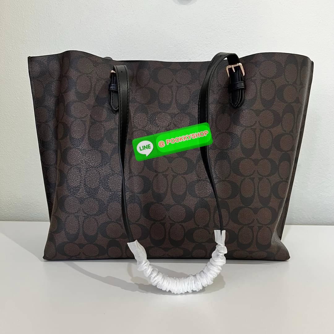 Coach MOLLIE TOTE IN SIGNATURE CANVAS (COACH 1665) กระเป๋าหนังใบเคลือบซิกเนเจอร์และหนังเรียบ ภายในกระเป๋ามัลติฟังก์ชั่น ปิดด้วยซิป ซับในผ้า หูหิ้วพร้อมหูหิ้ว 10 1/4" ช่องเปิดด้านข้าง
