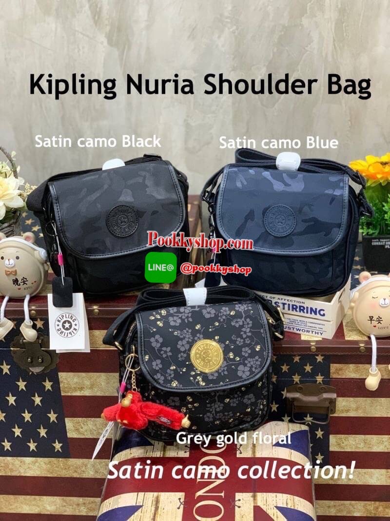 Kipling Nuria Shoulder Bag กระเป๋าสะพายคอลเลคชั่นล่าสุดของsatin camoรูปทรงสวยขนาดกระทัดรัด เปิดด้วยกระดุมแม่เหล็ก มีช่องกระเป๋าด้านหน้า มีช่องซิปหลัก ช่องซิปและช่องใส่ของจุกจิก พร้อมสายห้อยกุญแจด้านใน ด้านหลังมีช่องซิป สายสะพายเลื่อนปรับได้ตามต้องการ สะพา