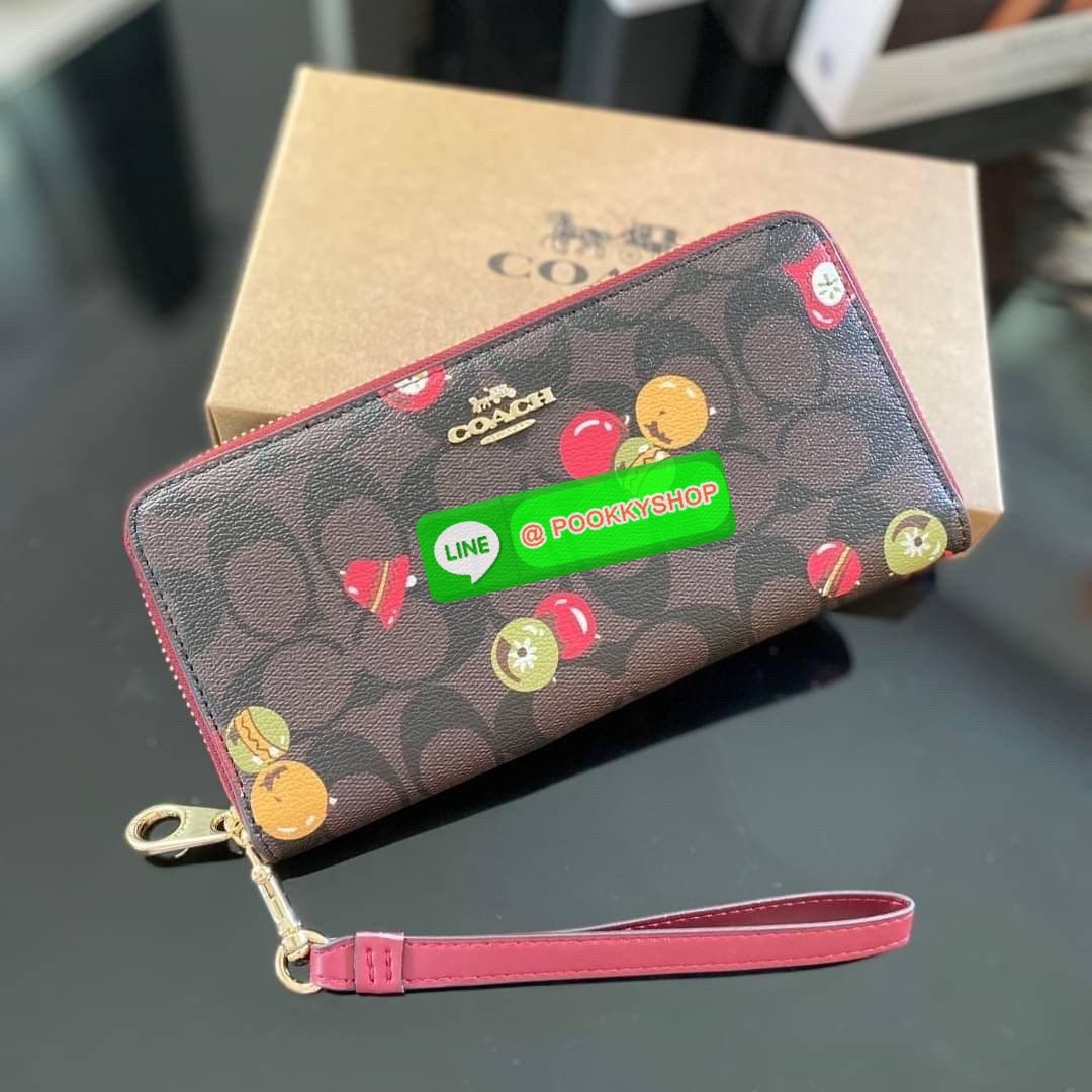 COACH C7411 LONG ZIP AROUND WALLET WITH ORNAMENT PRINT กระเป๋าสตางค์กึ่งกระเป๋าคล้องมือ ลวดลายน่ารัก วัสดุหนังแคนวาส เปิด-ปิดเ้วยซิปรอบ ภายในใส่บัตร ช่องใส่ธนบัตร และมีช่องซิปใส่เหรียญ สามารถใส่โทรศัพท์ได้ มาพร้อมสายคล้องมือ
