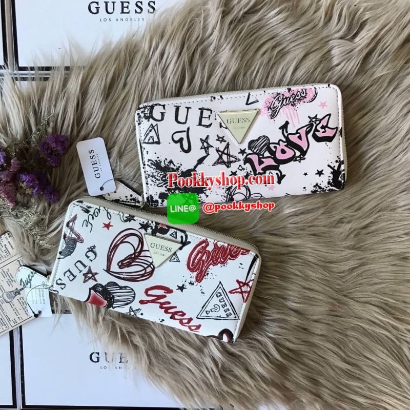 GUESS ABREE PRINTED ZIP-AROUND WALLET กระเป๋าสตางค์ใบยาวด้านหน้าประดับโลโก้แบรนด์นูนสามเหลี่ยม เปิดปิดด้วยซิป ภายในมีช่องใส่บัตร ช่องใส่ธนบัตร มีช่องซิปใส่เหรียญ และมีช่องยาวสามารถใส่บุ๊คแบงค์ได้ค่ะ