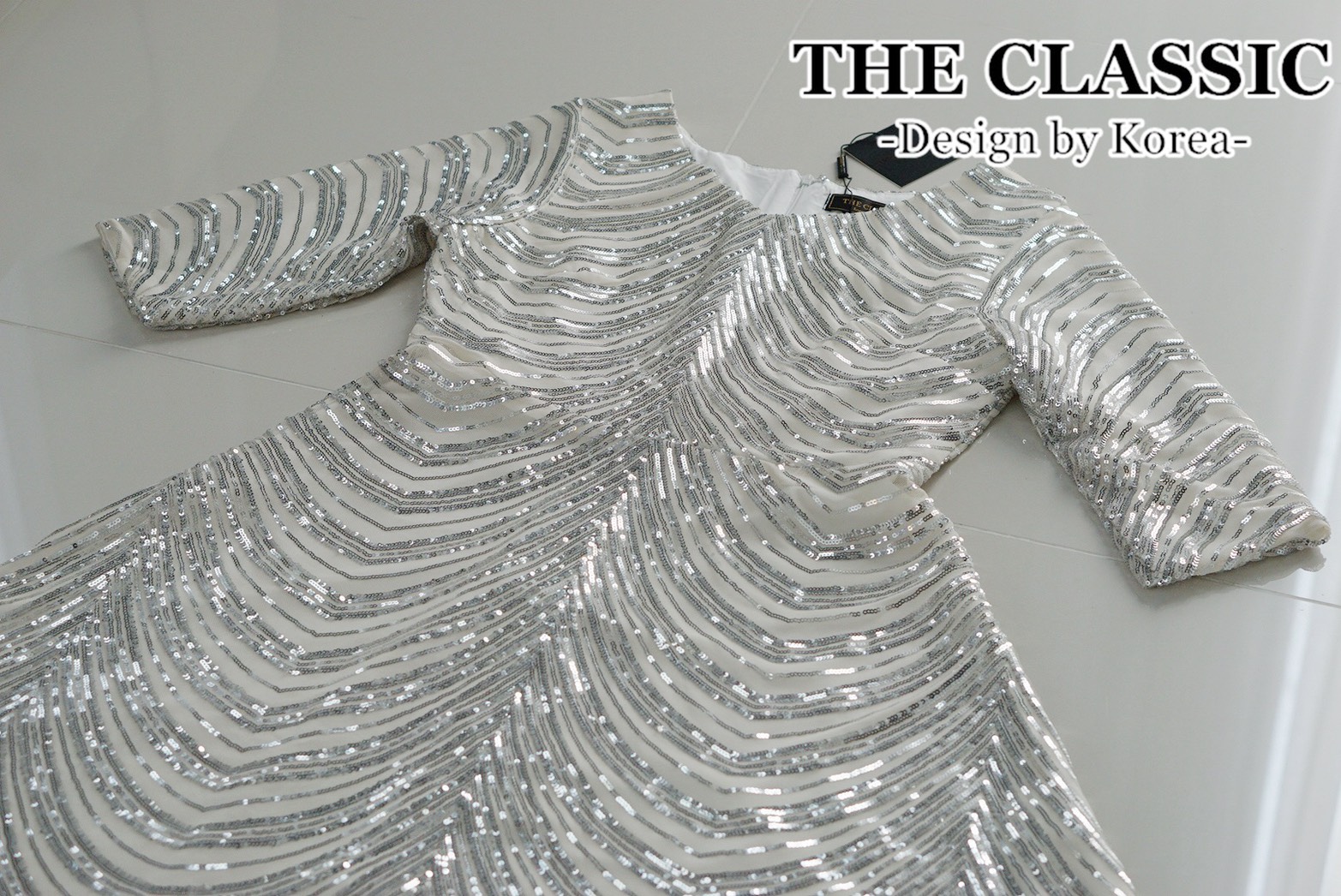เดรสแฟชั่น ชุดเดรสออกงานปักเลื่อมใช้ผ้าเนื้อดีปักด้วยเลื่อมสีเงิน