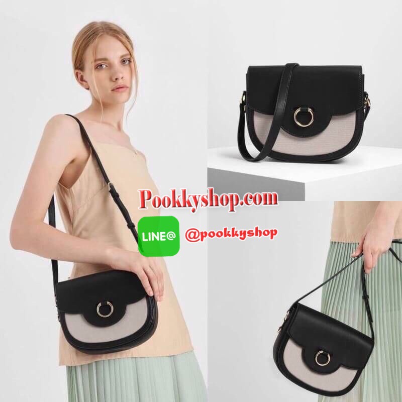 New arrival! 2019 CHARLES & KEITH RING BUCKLE SADDLE CROSSBODY BAG รุ่ยใหม่ชนช็อป!!! กระเป๋าสะพายข้าง/ครอสบอดี้อยู่ทรง วัสดุหนังตัดผ้าด้สนหน้า ด้านหลังมีช่องใส่ของได้เล็กน้อย เปิดปิดด้วยตัวล็อกดันขึ้น ด้านในเป็น 2 ช่องใหญ่ ใส่ของได้พอสมควรค่ะ เช่น iPhone