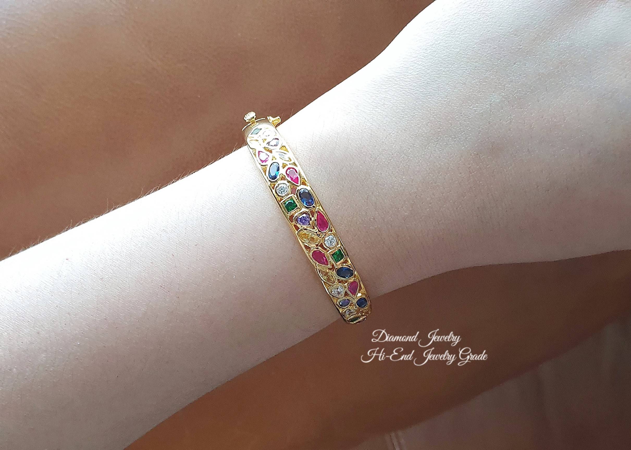 New Arrival !!!!! Diamond Bangle กำไลข้อมือประดับพลอยนพเก้า เสริมความเป็นสิริมงคลให้กับผู้ใส่ งานทอง 5 ไมครอน งานอย่างดีค่ะ รับประกันคุณภาพเลยค่ะ รุ่นนี้ดีไซส์สวย ใช้แม่พิมจากร้านเพชรเลยคะ งานสวยมากกกก ใส่ออกมาดูดี หรูหรา สีของทองเป็นสี 24K สีเหมือนทองแท้
