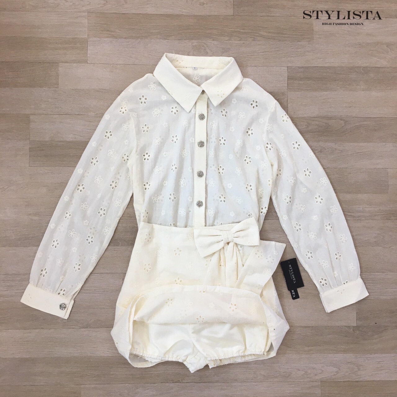 ชุดเซทแฟชั่น ชุดเซ็ต 2 ชิ้นทรงเชิ้ตแขนยาว + กระโปรงทรงไขว้ผูกโบว์สุดคิ้วท์