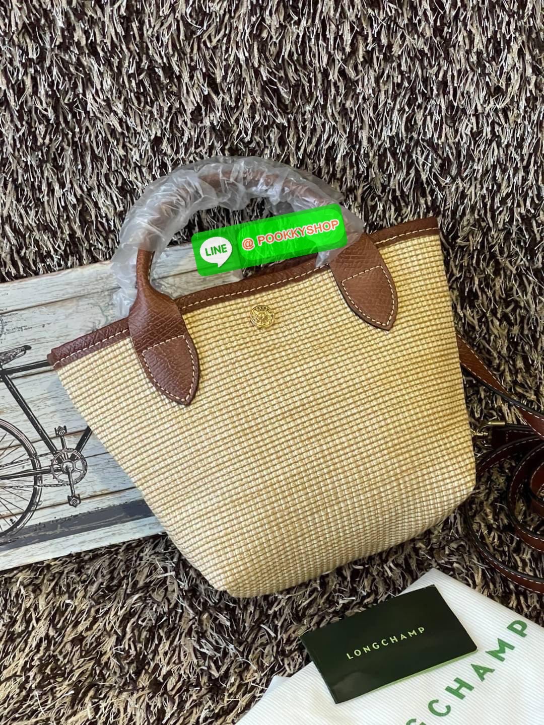 ðLONGCHAMP Le Pliage Paris - St Tropez Handtasche āļĢāļļāđāļāđāļŦāļĄāđāļāļēāļāđāļāļĢāļāļāđ āđāļāđāļāļāļĢāļ°āđāļāđāļēāļāļ·āļāļŦāļĢāļ·āļāļŠāļ°āļāļēāļĒ āļāļēāļāļŠāļēāļ raffia āļāļēāļāļāļĢāļ°āđāļāđāļēāļāļąāļāļāđāļ§āļĒāļŦāļāļąāļāļŠāļĩāļāđāļ§āļĒāļĨāļļāļāļāđāļŠāļļāļāđāļāđāļāļāļāđāļŦāļĨāđāļē Celebrities āļāļąāļāļāļĢāļ°āđāļāđāļēāļāļīāļāļāļīāļāļŠāļļāļāļŪāļīāļāļāļēāļ Longchamp āļāļĒāđāļēāļ Le Pliage Paille (āđāļĨāļ āļāļĨāļīāļĒāļēāļ āđāļāļĨāđ) āļĄāļĩāđāļĨāđ