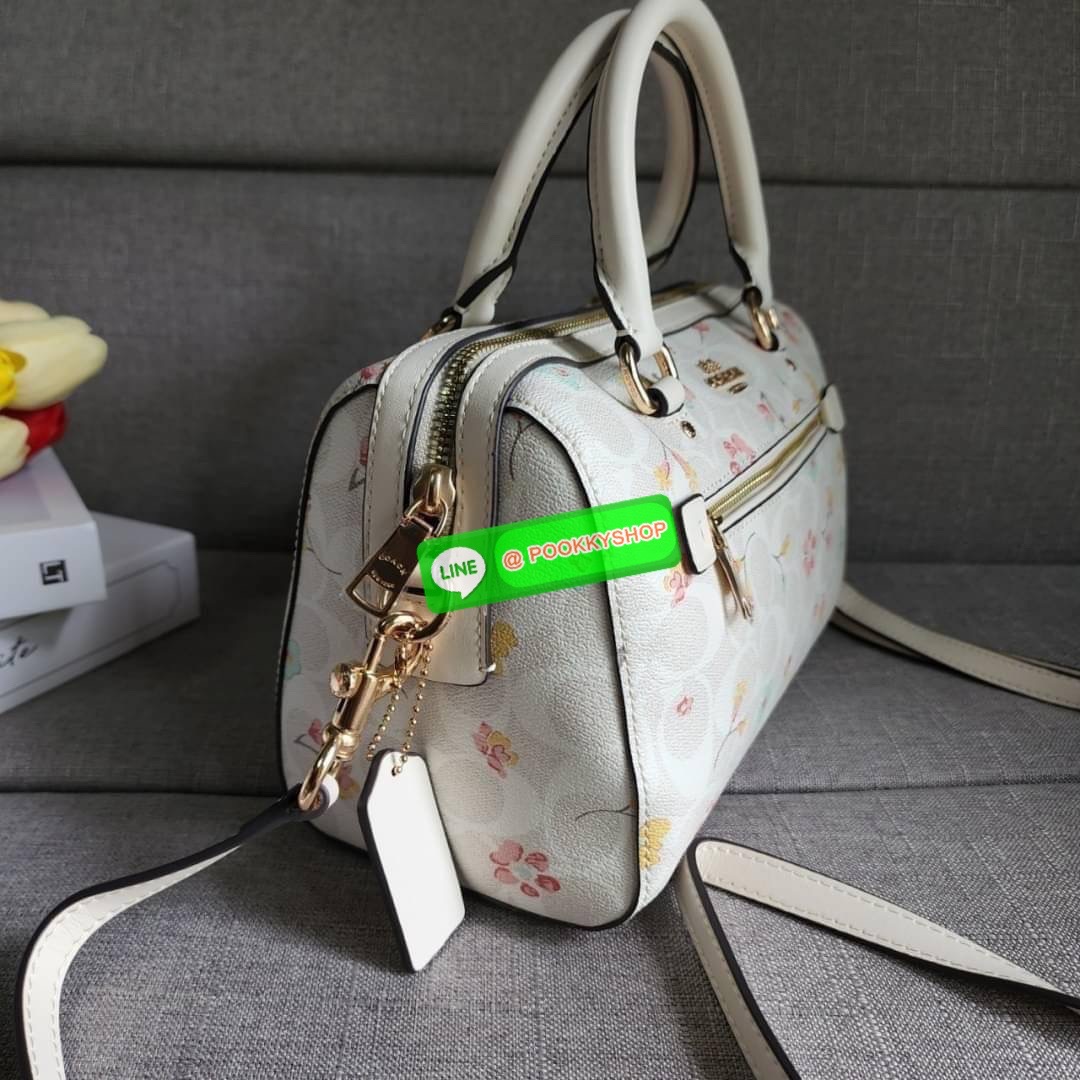COACH ROWAN SATCHEL IN SIGNATURE CANVAS WITH MYSTICAL FLORAL PRINT (COACH C8615) กระเป๋าสะพายข้างทรงหมอนเป็นอีกรุ่นมาแรงสุดๆ ฮอตตลอด เป็นทรงที่ต้องมาติดตู้ โดดเด่นอย่างลงตัวกับรุ่นนี้ หมอน 10" รุ่นมีช่องซิปด้านหน้า สามารถแยกเก็บของสำคัญๆได้อย่างเป็นส