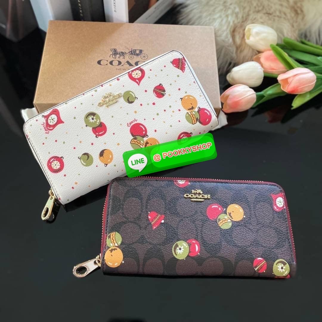 COACH C7411 LONG ZIP AROUND WALLET WITH ORNAMENT PRINT กระเป๋าสตางค์กึ่งกระเป๋าคล้องมือ ลวดลายน่ารัก วัสดุหนังแคนวาส เปิด-ปิดเ้วยซิปรอบ ภายในใส่บัตร ช่องใส่ธนบัตร และมีช่องซิปใส่เหรียญ สามารถใส่โทรศัพท์ได้ มาพร้อมสายคล้องมือ