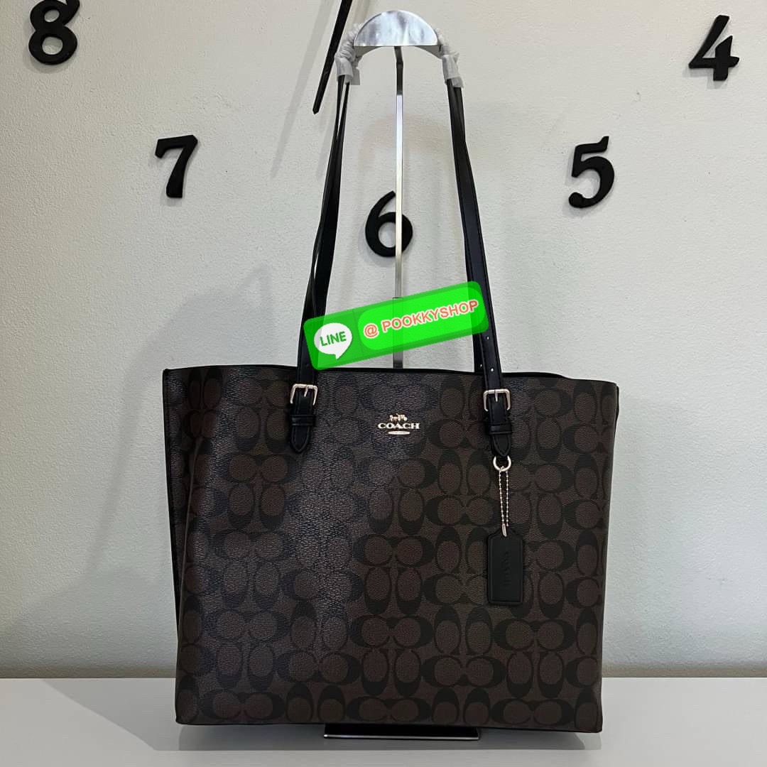 Coach MOLLIE TOTE IN SIGNATURE CANVAS (COACH 1665) กระเป๋าหนังใบเคลือบซิกเนเจอร์และหนังเรียบ ภายในกระเป๋ามัลติฟังก์ชั่น ปิดด้วยซิป ซับในผ้า หูหิ้วพร้อมหูหิ้ว 10 1/4" ช่องเปิดด้านข้าง