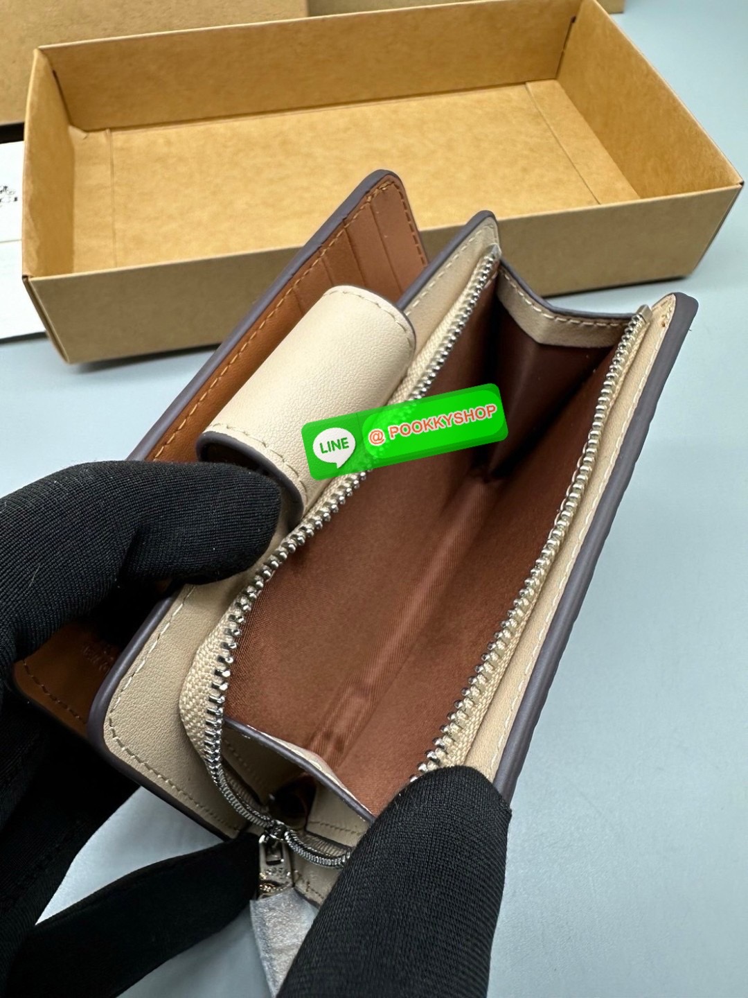 Coach Billfold Wallet With Floral Print Polished pebble leather Eight credit card slots Full-length bill compartment Snap closure Outside zip coin pocket