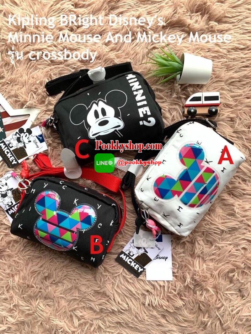 Kipling BRight Disney's Minnie Mouse And Mickey Mouse รุ่น crossbody น้ำหนักเบา วัสดุ100% Polyamide มีเหล่าบรรดามิคกี้และมินนี่ที่มาวาดลวดลายลงบนกระเป๋าให้ดูมีสีสัน ที่มีเอกลักษณ์เฉพาะตัว และยังเป็นรุ่นลิมิเต็ดเอดิชั่นฉลองครบ90ปีของวอลท์ดิสนีย์อีกด้ว