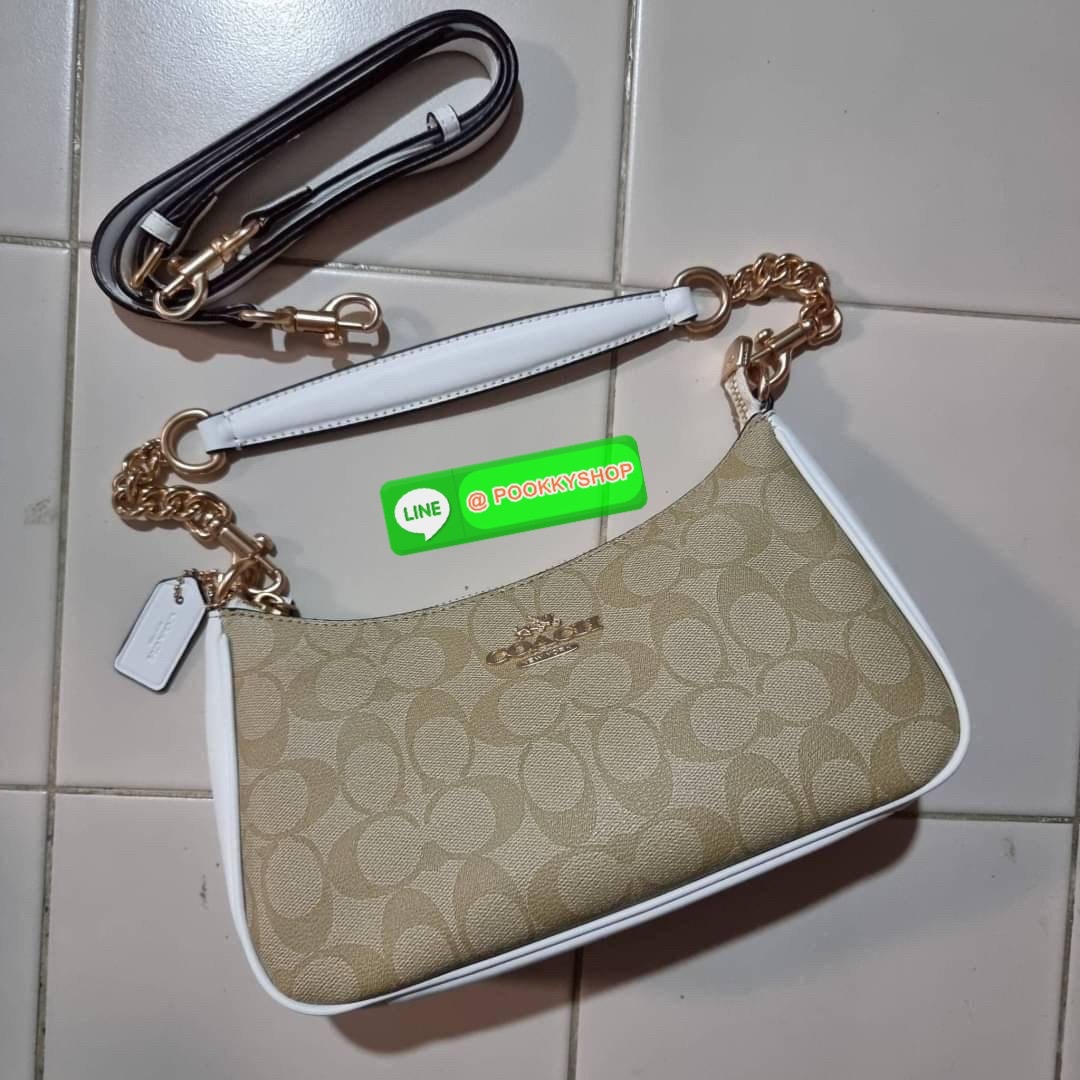 COACH CA548 TERI SHOULDER BAG IN SIGNATURE CANVAS คอลเลคชั่นใหม่ล่าสุด ที่สาวๆรอคอย กระเป๋าสะพายไหล่กึ่งทรงพอช พร้อมเสิร์ฟความสวยถึงบ้านไปเลยก่อนใคร แบบไม่ต้องพรีฯ ด้วยดีไซน์คลาสสิคที่แอบแฝงความเรียบหรู มาพร้อมสายสะพาย 2 เส้น เป็นสายโซ่คล้องแขนและสายสะพาย
