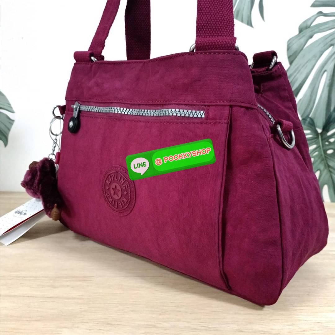 KIPLING ELISE HANDBAG กระเป๋าถือและสะพายไหล่ วัสดุ Nylon +Polyester ขนาดกำลังพอดี จุของได้มาก มีหูจับสองสาย ถือสะดวก น้ำหนักเบา มีช่องซิป ด้านหน้า ช่อง กระเป๋าหลักเปิด-ปิดด้วยซิป มี3 ช่องว่างใส่ของได้จุมากๆ ใส่มือถือได้ กระเป๋าสตางค์ใบยาว และ เครื่องสำอาง