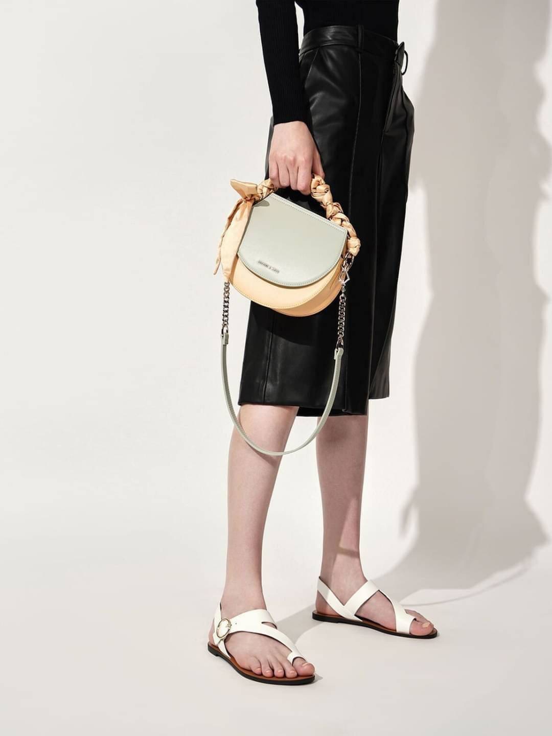 New arrival! Charles & Keith Satin Scarf Semi Circle Bag กระเป๋าสะพายหนังเรียบสีสวยหวานละมุนตุนมากกกกก❤️ แต่งโซ่พันซาตินเพิ่มลุคเก๋ให้กระเป๋า เปิดปิดแบบแม่เหล็กดูด ด้านในจุของได้เยอะทีเดียวจ้า สามารถใส่ iPhone plus, กระเป๋าเงินใบกลางได้ มีช่องซิป 1