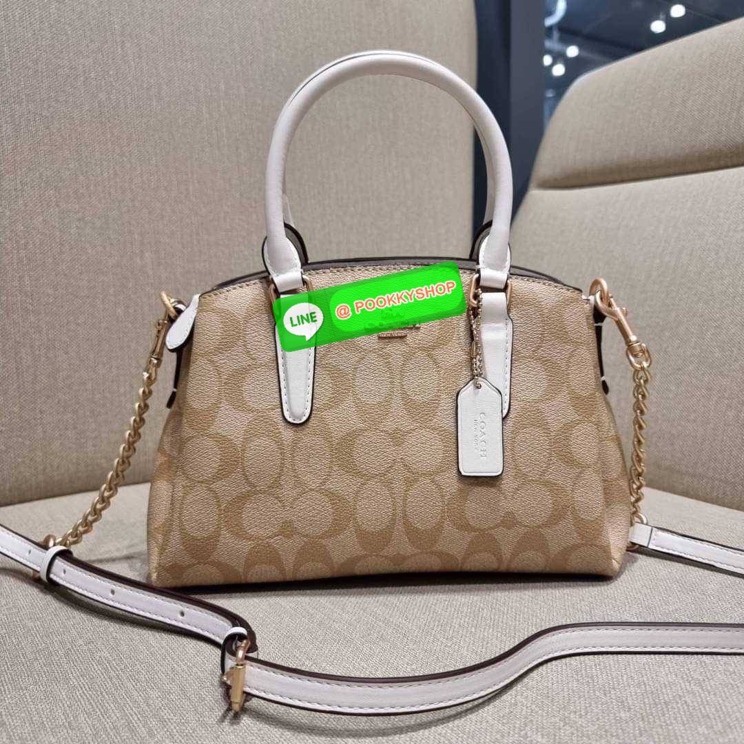 COACH F29434 MINI SAGE CARRYALL IN SIGNATURE CANVAS รุ่นยอดฮิต!! ที่สุดของกระเป๋าสะพายขายดี ต้องทรงถังมินิรุ่นนี้ วัสดุหนังแคนวาสเคลือบลาย สวย คลาสสิค มาพร้อมสายสะพายข้างและหูหิ้วในตัว ถอดออกถือคล้องแขนเก๋ๆ หรูๆยังได้ ภายในเป็นช่องโล่ง แบ่งสัดส่วนอย่างดี