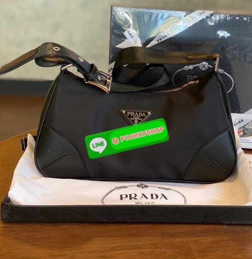 prada nylon shoulder bag black This chic shoulder bag is crafted of fine tessuto nylon in black. This bag features sturdy calfskin leather top handle and silver hardware. The top zipper opens with a black jacquared fabric interior with zipper pocket. This