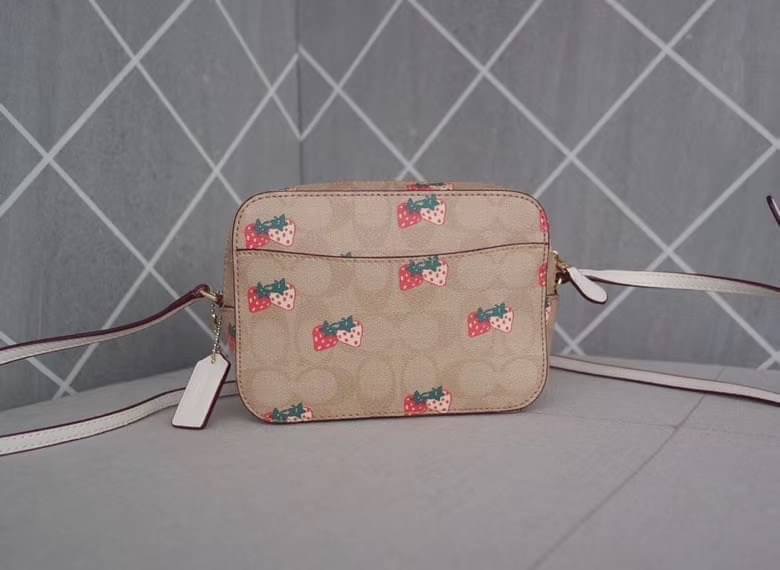 Coach MINI CAMERA BAG IN SIGNATURE CANVAS WITH STRAWBERRY PRINT IM/KHAKI MULTI Signature coated canvas with smooth leather details| Two credit card slots| Inside multifunction pocket| Zip closure, fabric lining| Outside open pocket| Adjustable strap with